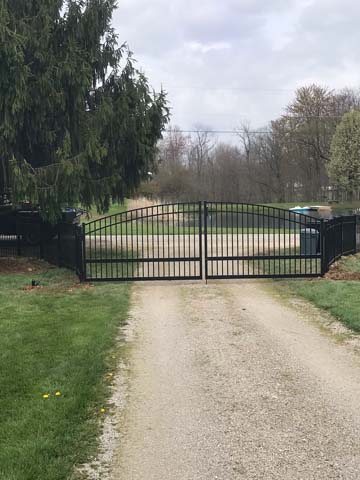 Decorative garden entry gate with black powder-coated finish