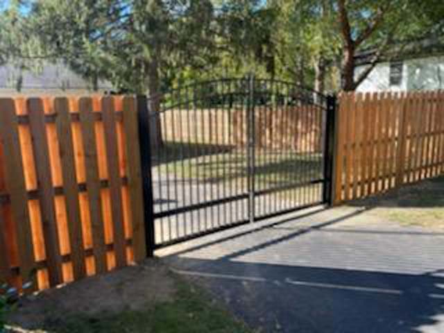 Specialty outdoor gate with custom metalwork design